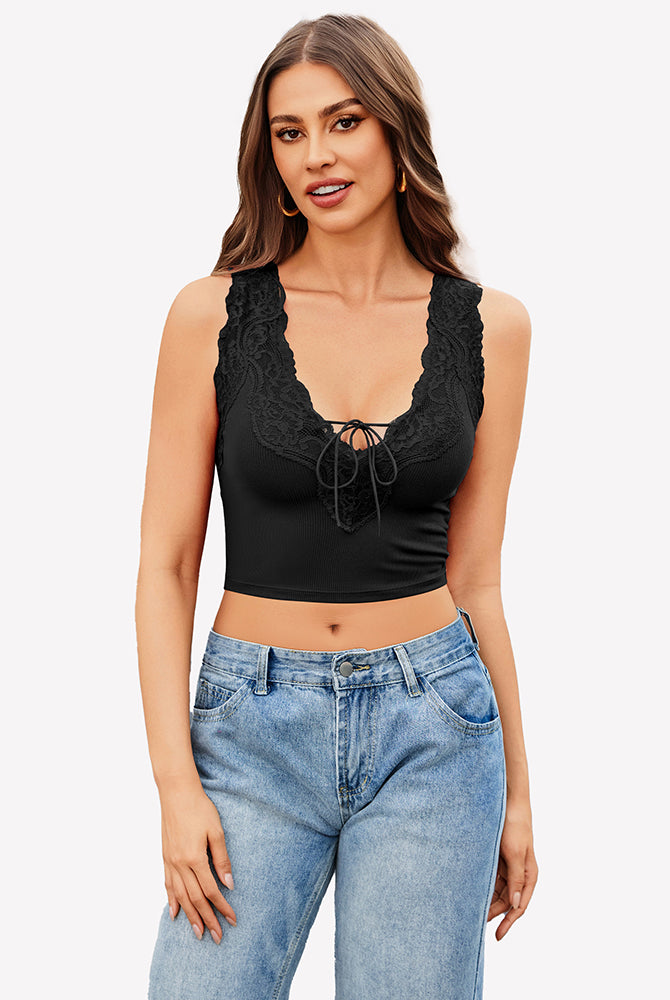 Black V-neck crop top with lace trim and tie-up front, paired with jeans. Sexy and charming style.
