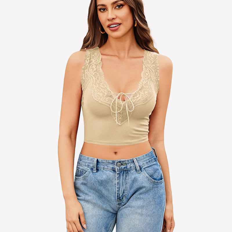 Beige V-neck crop top with lace trim and tie-up front, paired with jeans. Sexy and charming style.