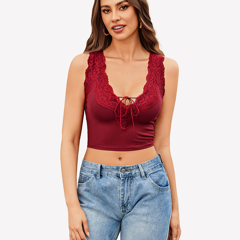 Burgundy V-neck crop top with lace trim, tie-up front, paired with jeans. Sexy and charming.