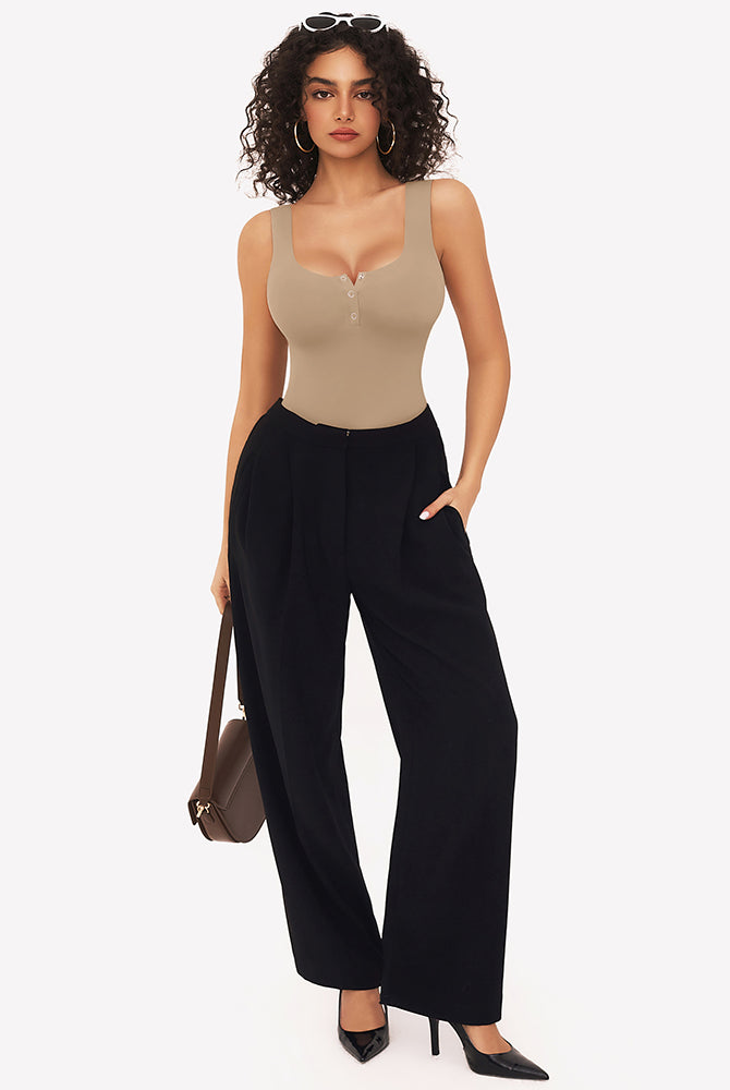 Beige button down square neck sleeveless bodysuit, black pants, perfect for various occasions.