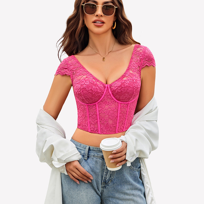 Pink floral lace bustier crop top with cap sleeves, styled with blue jeans and sunglasses