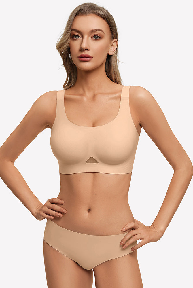 Nude seamless padded U-neck wireless bra on model, adjustable straps