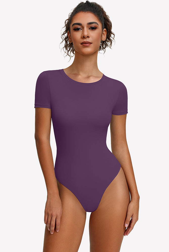 Purple short-sleeve snap bodysuit, fitted one-piece leotard top.