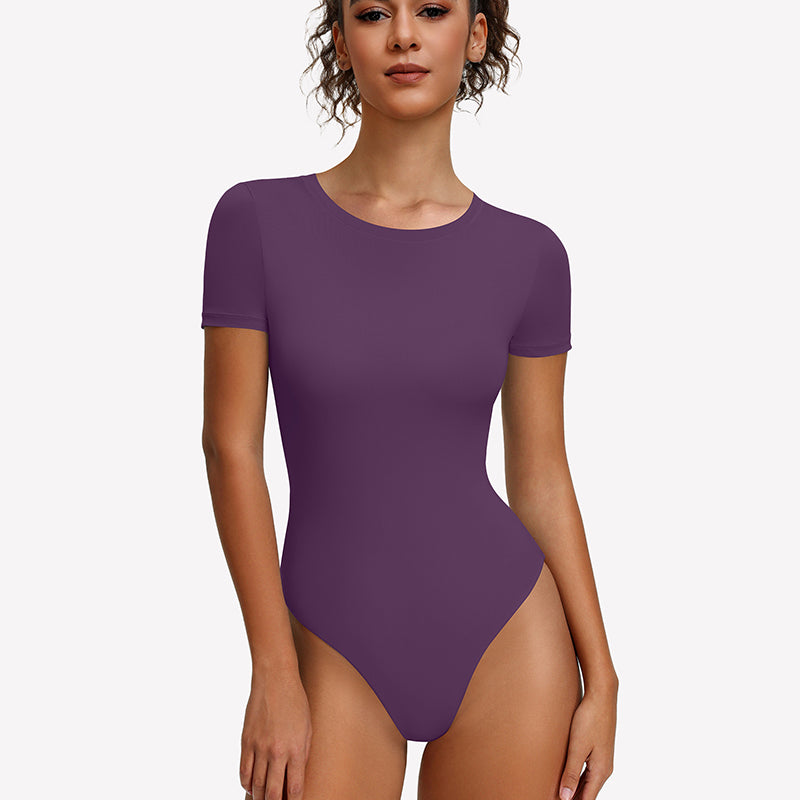 Purple short-sleeve snap bodysuit, fitted one-piece leotard top.