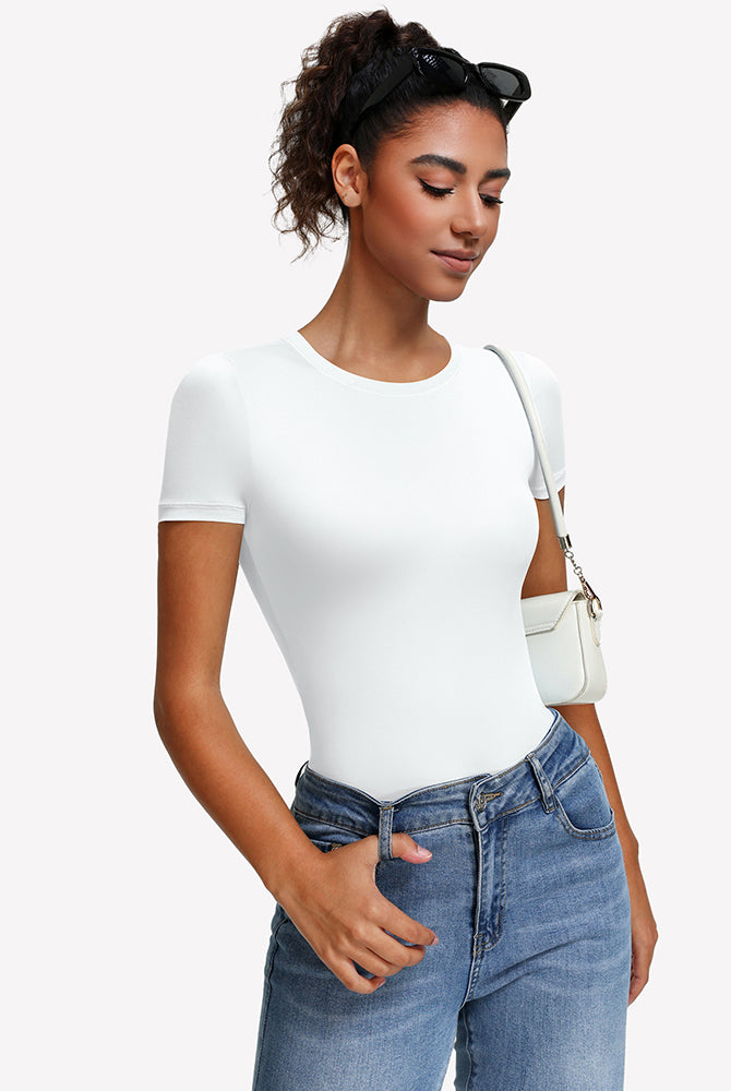 White short sleeve snap bodysuit one-piece leotard with round crew neck, worn with jeans