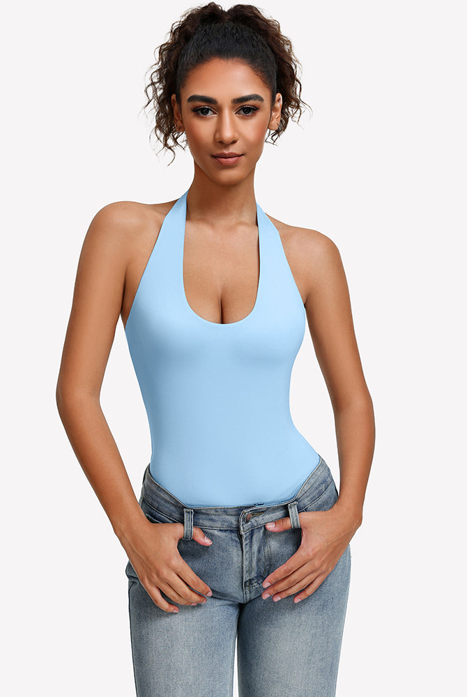 Light blue halter bodysuit with deep scoop neckline, worn with blue jeans