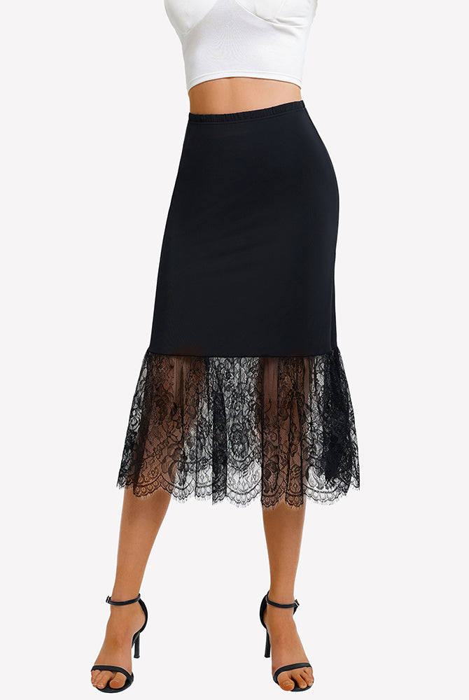 Black lace half slip underskirt with straight midi silhouette and scalloped lace hem.