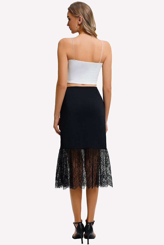 Black lace half slip underskirt shown from the back with midi length and scalloped lace hem.
