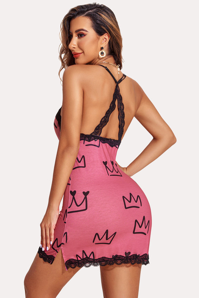 Pink slip dress with crown print and black lace trim. Sexy lingerie with adjustable spaghetti straps