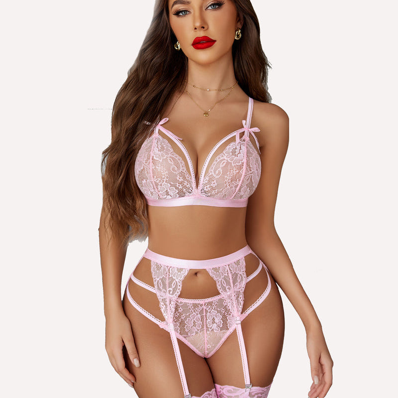 Pink lace lingerie set with garter belt and adjustable straps on a model