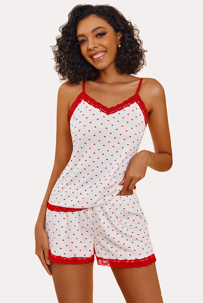 Woman in a pink Love pajama set with red lace trim, a comfortable and breathable sleepwear.