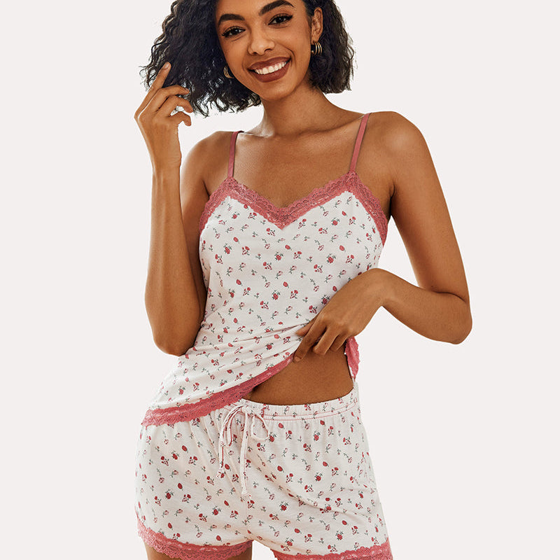 Floral print cami pajama set with pink lace trim. Comfortable sleepwear, model smiling.
