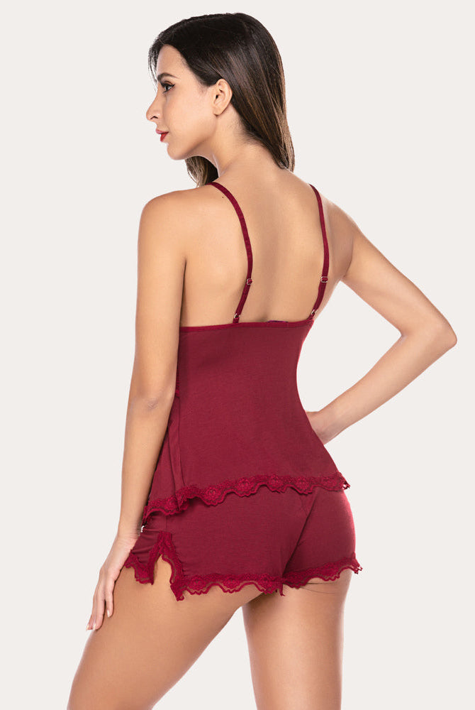 Burgundy lace nightwear pajama set with adjustable straps, floral detail, soft, breathable fabric.