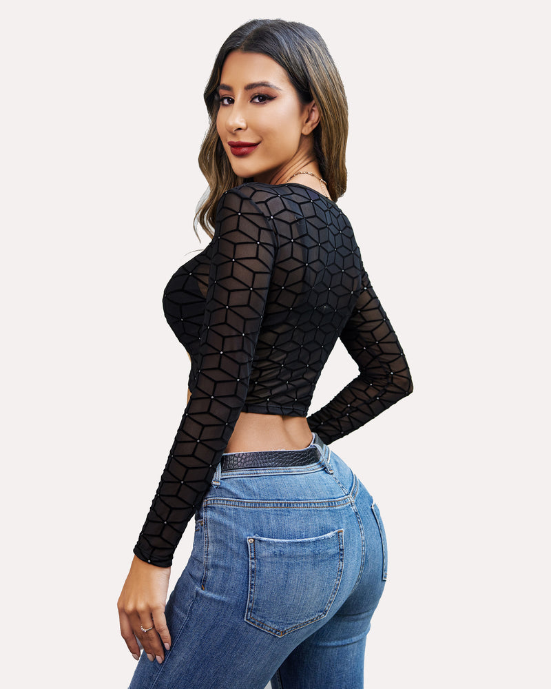Black mesh crop top with geometric pattern and denim jeans. Sexy and comfortable style.