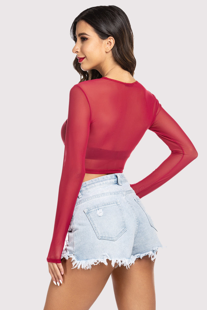 Red sheer mesh crop top with long sleeves and denim shorts. Stylish lingerie for women.