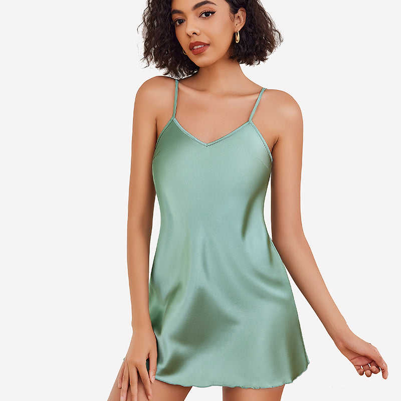 Mint green satin slip nightgown with adjustable straps, confident woman's lingerie, silky fabric.