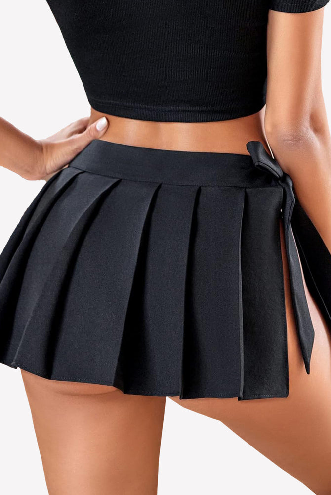 Black pleated mini skirt with side lace-up design, perfect for role play, showing off legs.