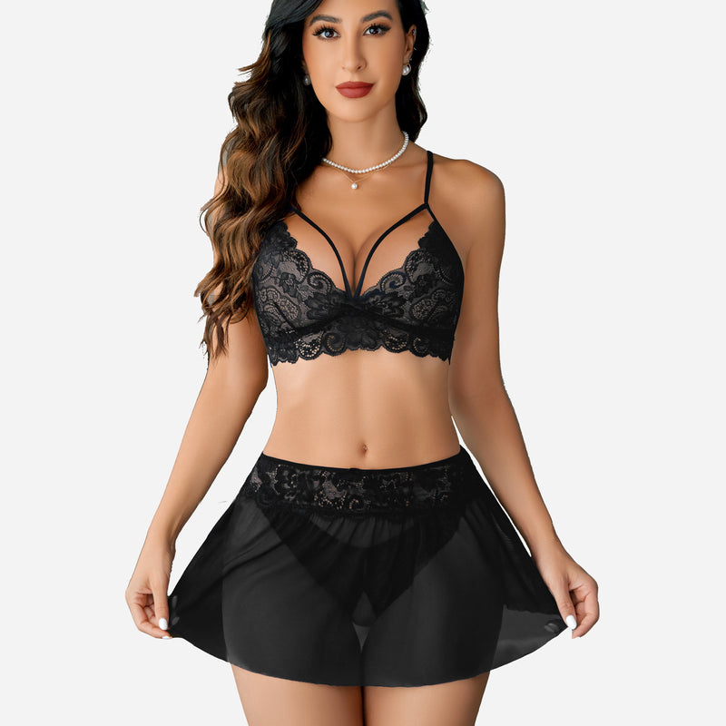 Black lace bralette and skirt lingerie set with lace trim. Perfect for intimate moments.