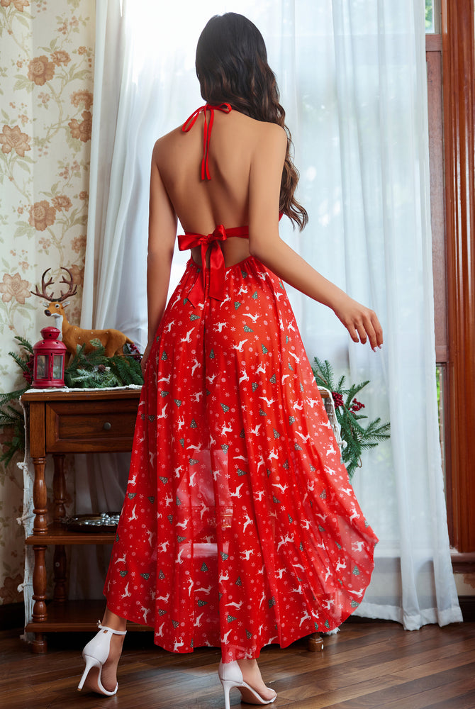 Red Christmas lingerie dress, reindeer print, halter neck, high slit. Sexy holiday look.