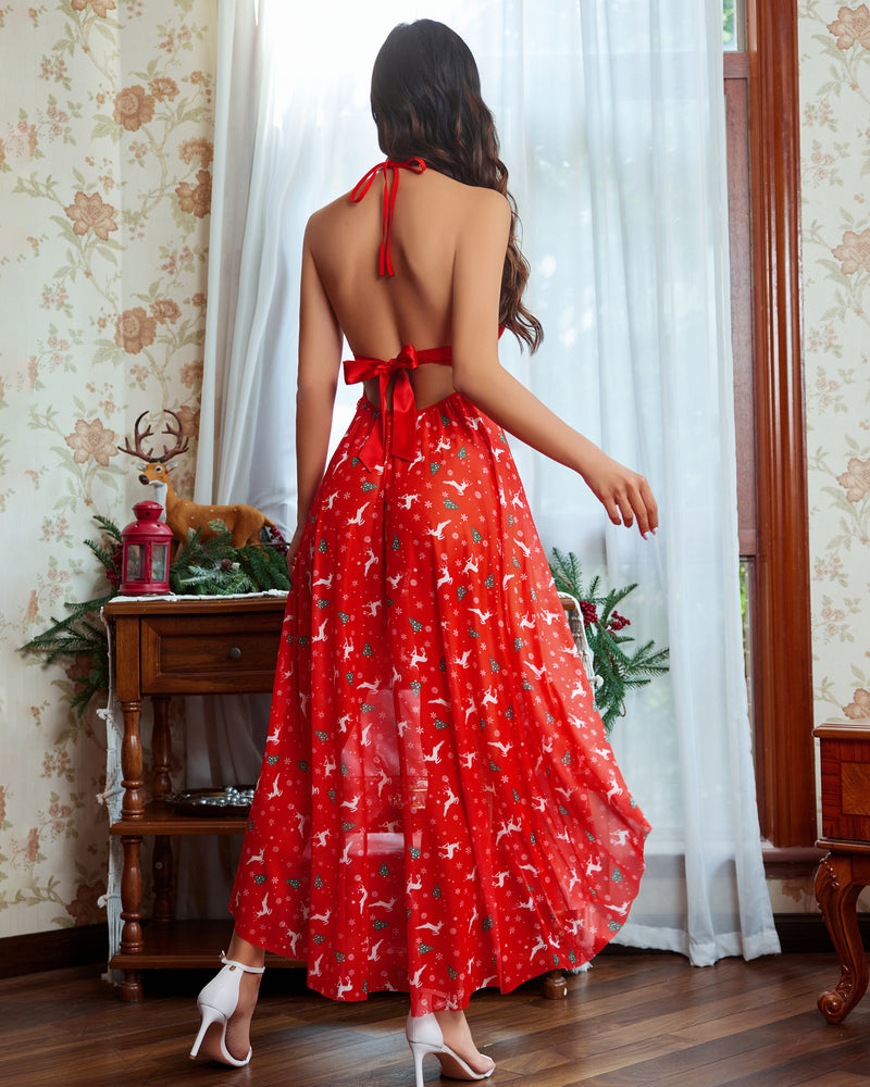 Red Christmas lingerie dress, reindeer print, halter neck, high slit. Sexy holiday look.