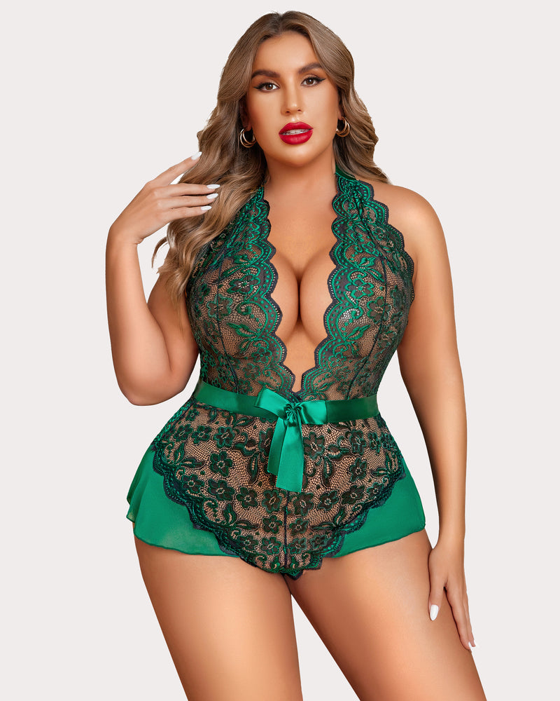 Green plus size halter lace bodysuit with satin bow and floral detailing.