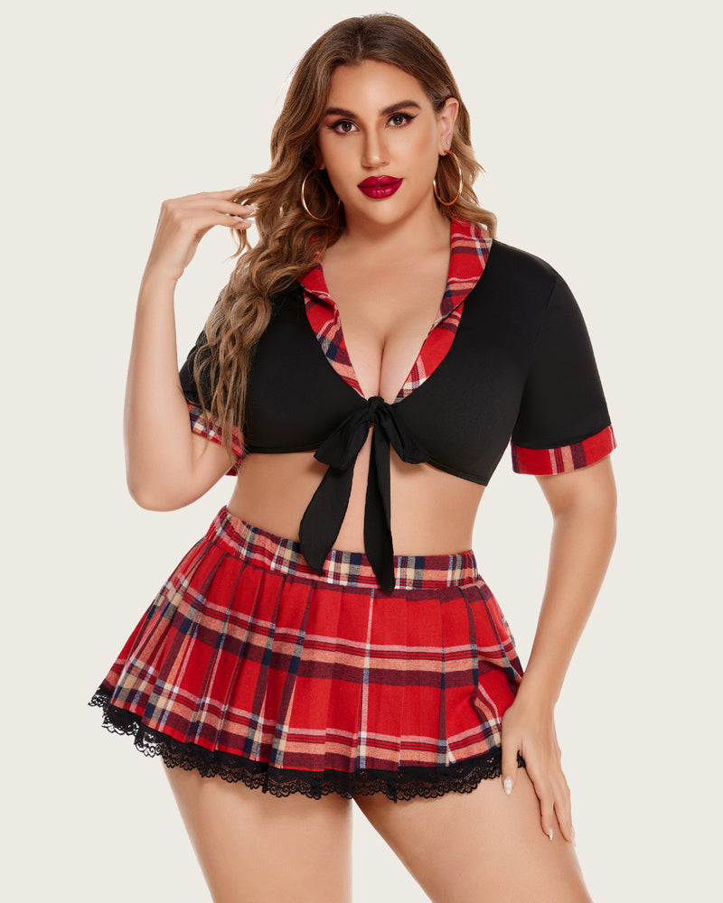 Plus size schoolgirl lingerie set: black tie top and red plaid mini skirt. Confident style.