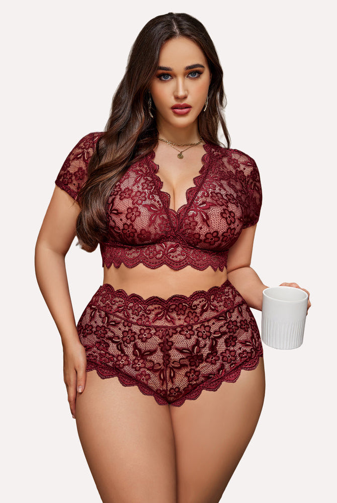 Burgundy floral lace plus size lingerie set: deep V bra and shorts, model holding a mug.