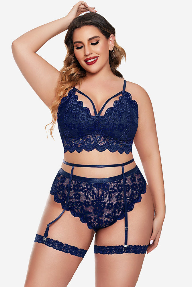Plus size navy blue lace lingerie set: bralette, panties, garter belt. Sexy floral design.