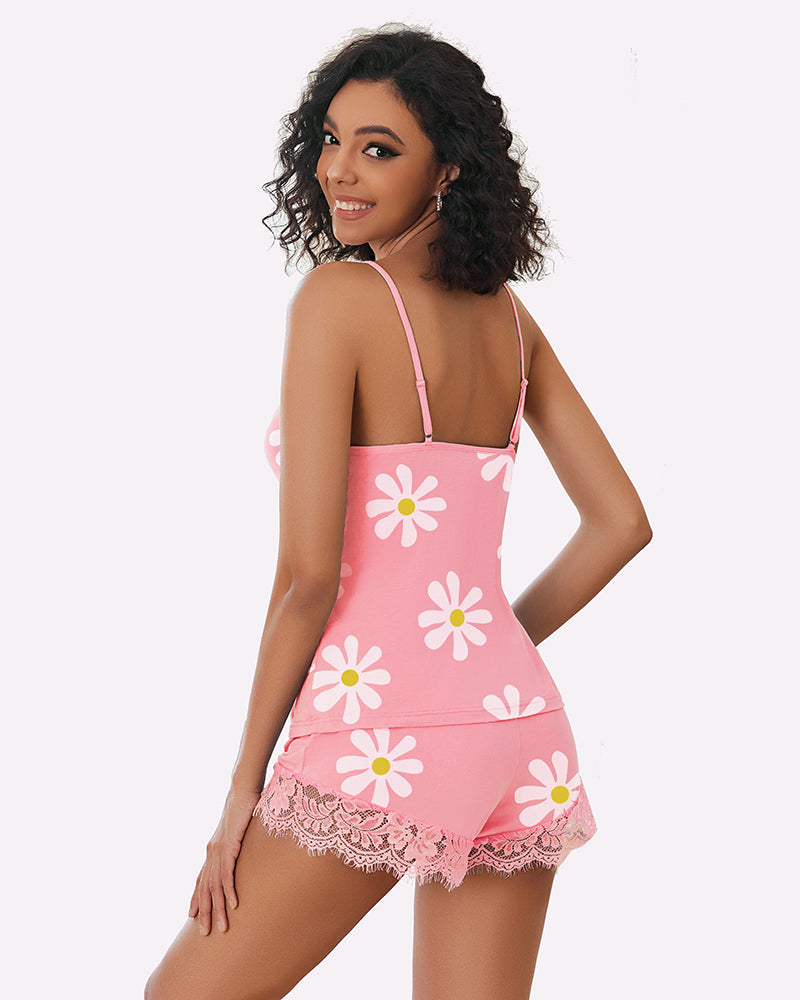 Pink floral pajama set for women with daisy print and lace trim, comfortable sleepwear.