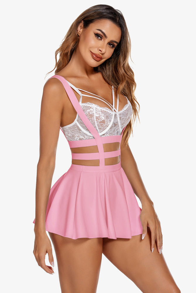 Pink A-line pleated skirt and suspenders with white bralette. Sexy lingerie.
