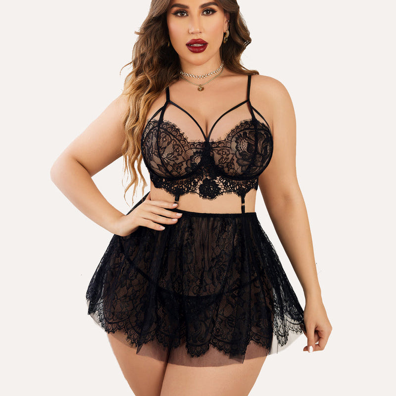 Plus size black lace babydoll lingerie set. Includes bralette and sheer skirt, flattering fit.