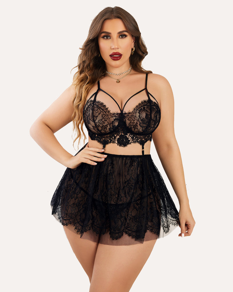 Plus size black lace babydoll lingerie set. Includes bralette and sheer skirt, flattering fit.