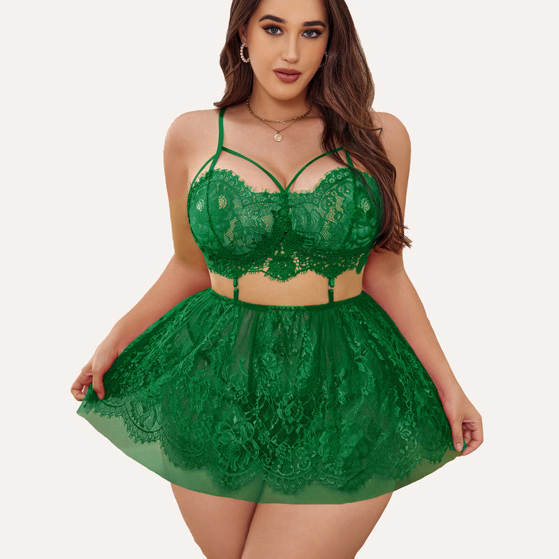Plus size emerald green lace babydoll lingerie with strappy bralette and sheer skirt.