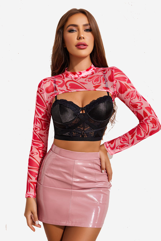 Red heart pattern see-through crop top with black bra and pink mini skirt. Sexy, confident look.