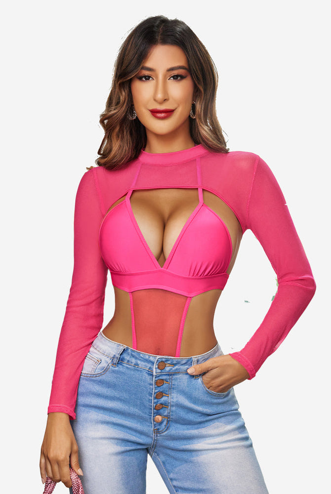 Pink mesh mock neck crop top with keyhole design, long sleeves, and jeans. Confident lingerie style.