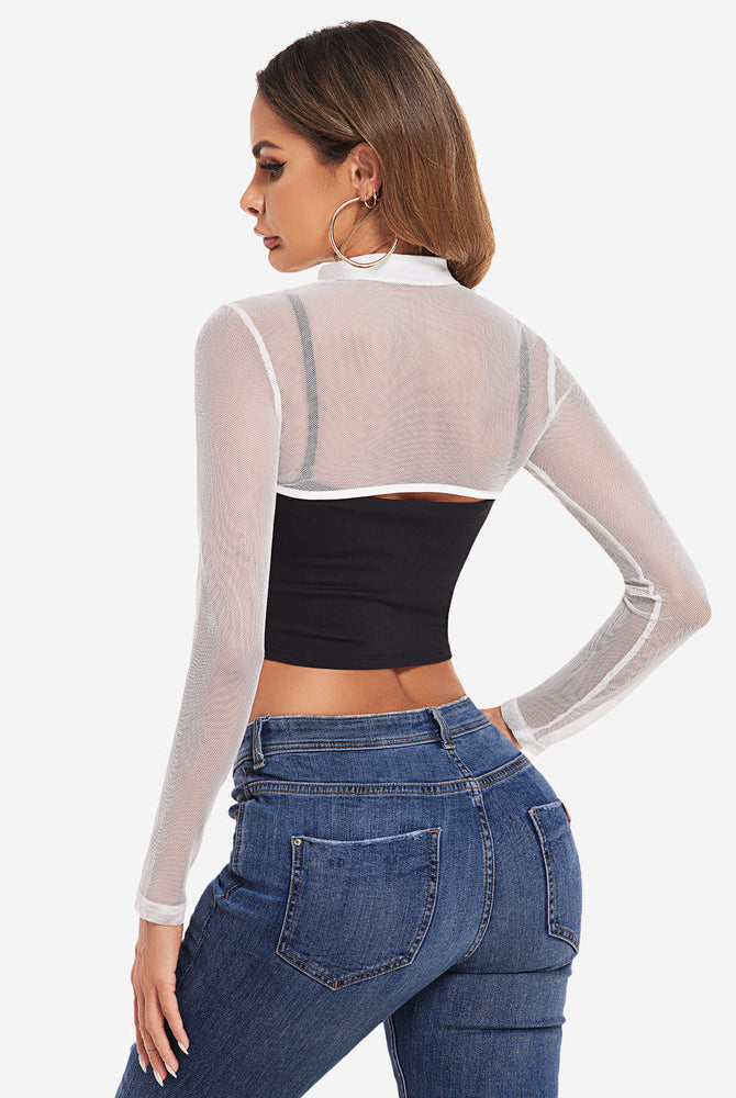 Mock neck mesh crop top with long sleeves, black bandeau, blue jeans. Sexy lingerie.