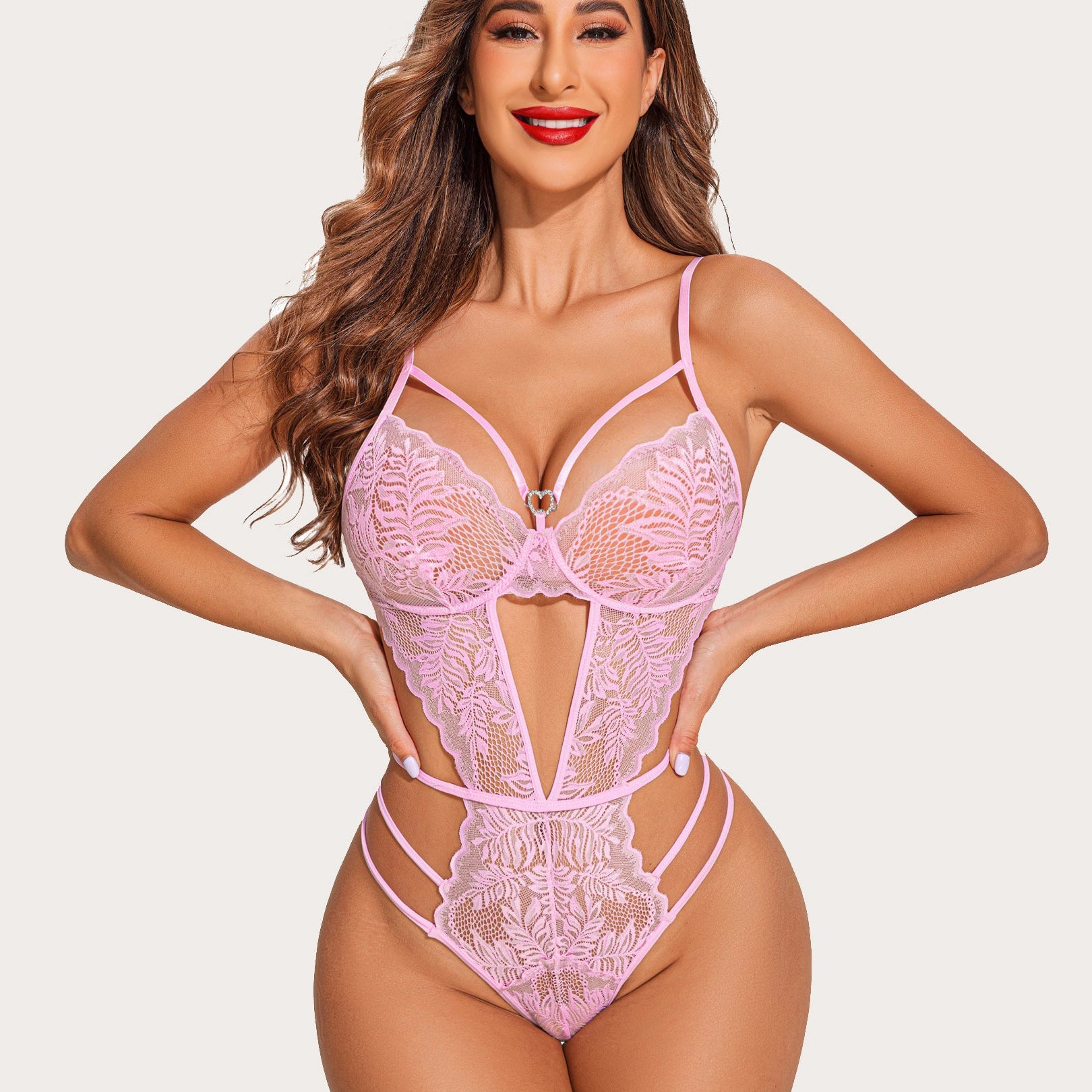 Pink lace deep V lingerie bodysuit with strappy design and scalloped trim.