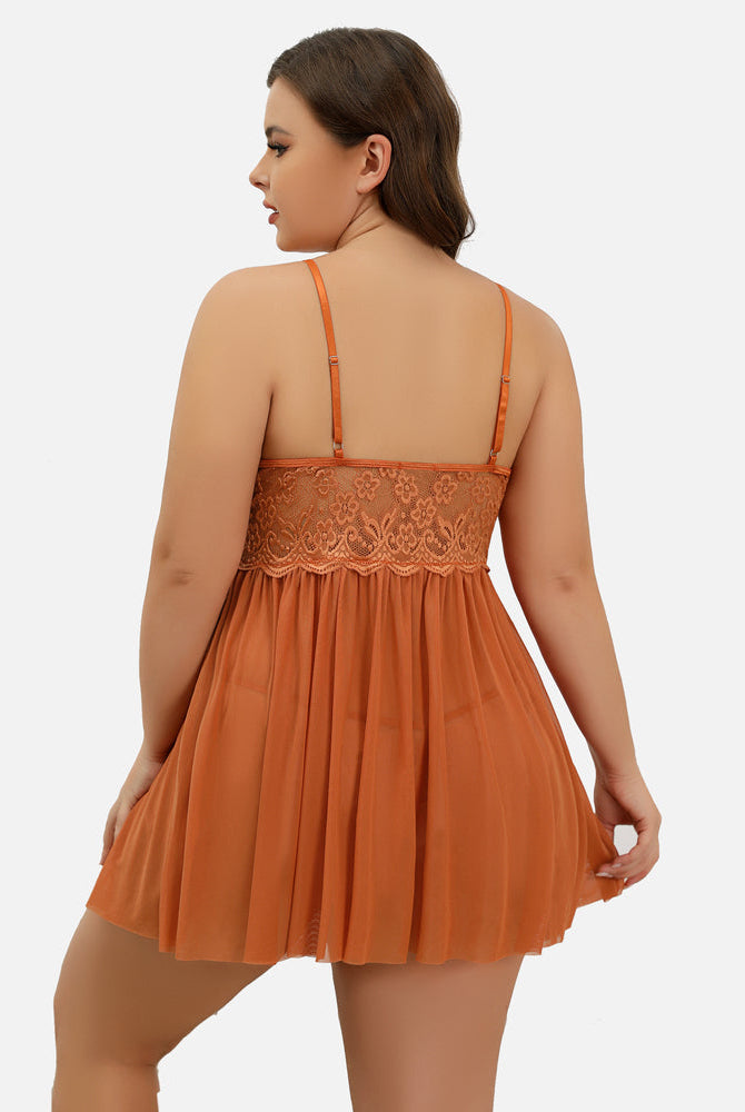 Plus size orange babydoll lingerie with lace bodice, adjustable straps and flowing skirt.
