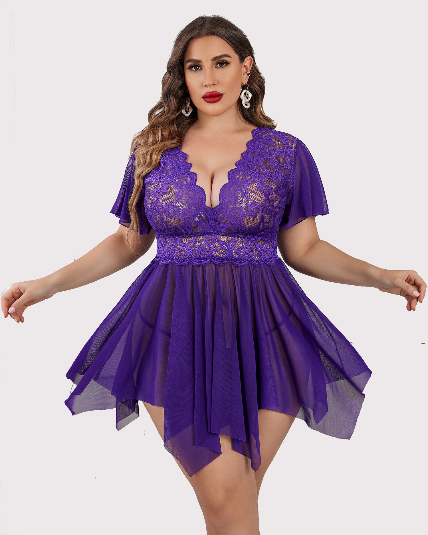 Purple plus size babydoll lingerie with floral lace, deep V-neck and asymmetrical hem.