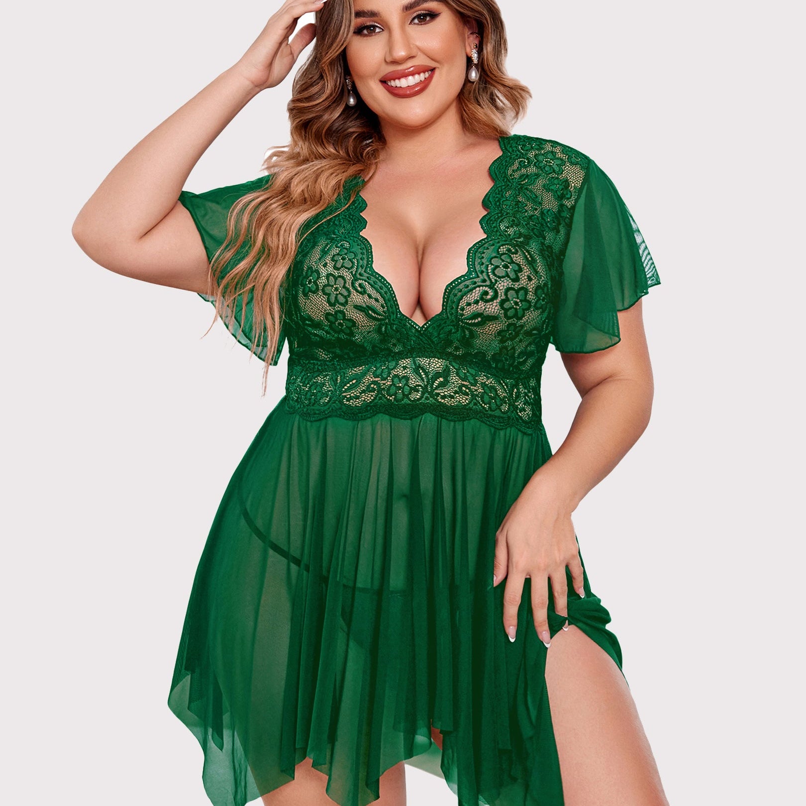 Plus size green babydoll lingerie with floral lace, deep V-neck and asymmetrical hem.