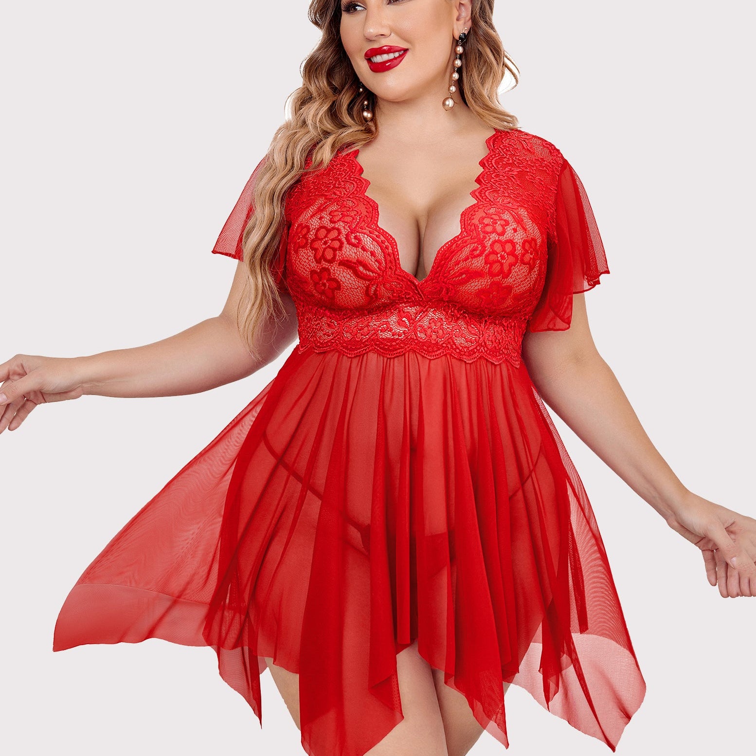 Plus size red babydoll lingerie with floral lace, deep V-neck, and flowing asymmetrical hem.