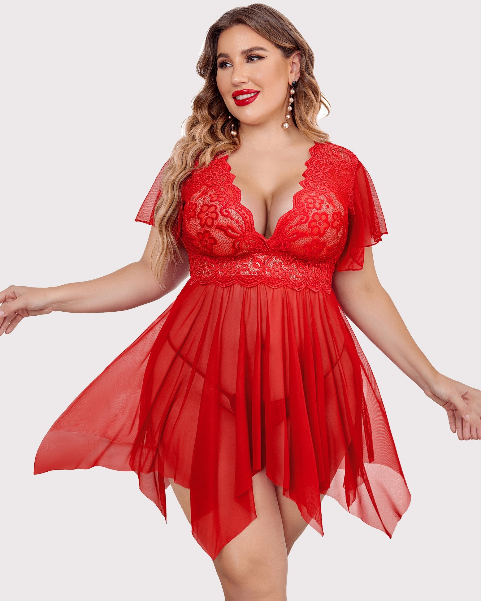 Plus size red babydoll lingerie with floral lace, deep V-neck, and flowing asymmetrical hem.