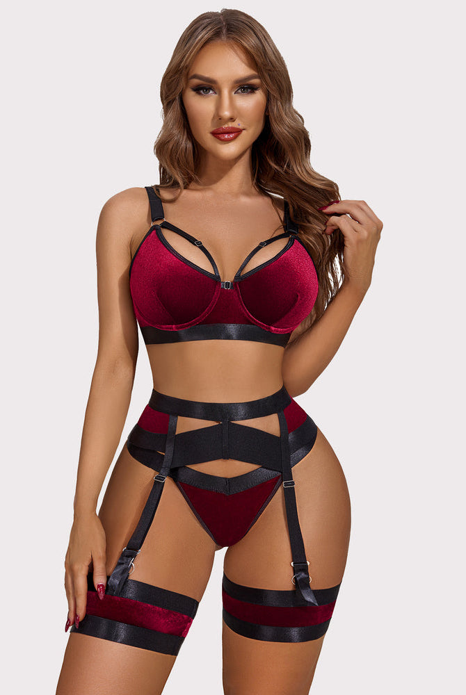 Red velvet push-up lingerie set with garter belt. Enhancing femininity and showing curves