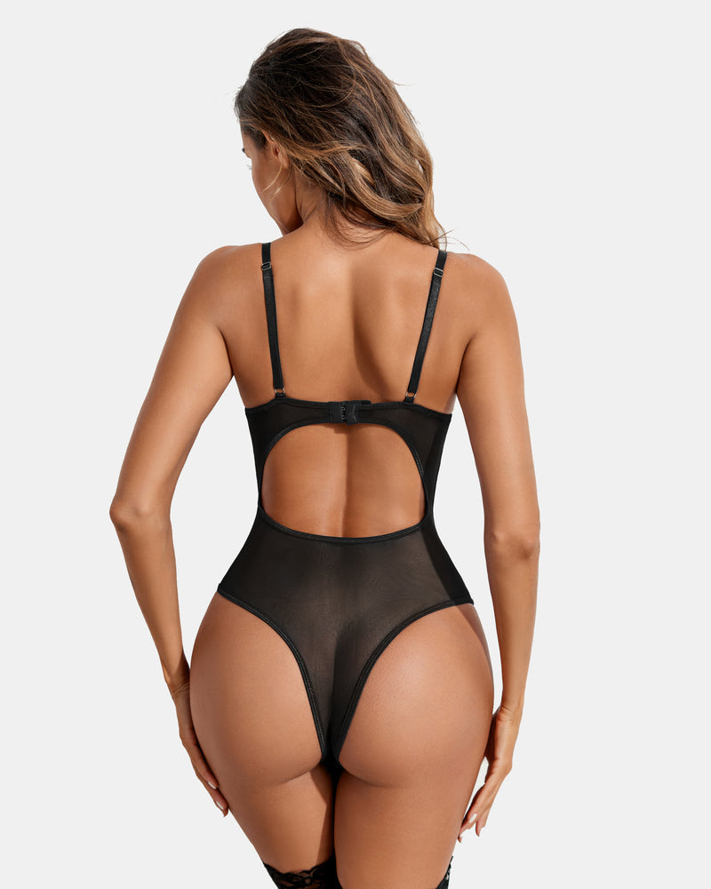 Black strappy teddy bodysuit with adjustable straps and high-cut design. Sexy lingerie for women.
