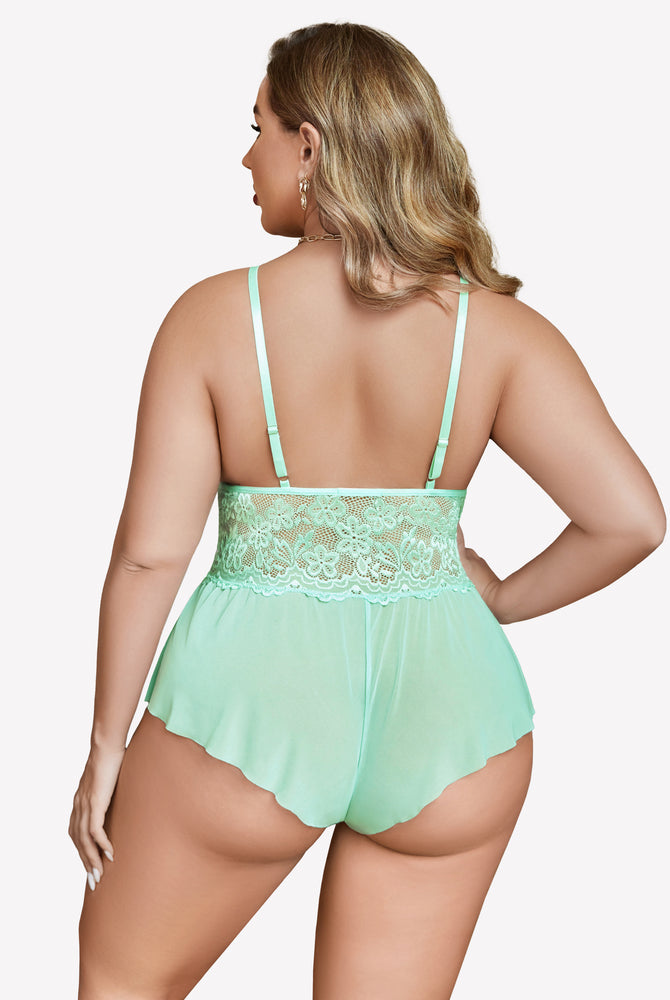 Plus size mint green lace bodysuit with adjustable straps and delicate lace trim, model back view