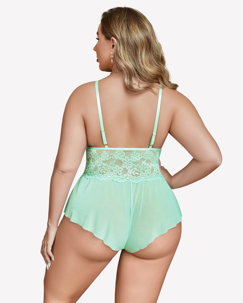 Plus size mint green lace bodysuit with adjustable straps and delicate lace trim, model back view