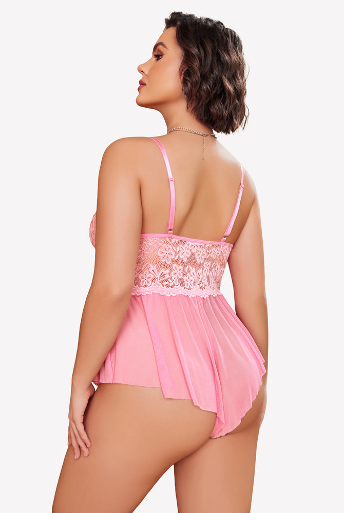 Plus size pink lace bodysuit with adjustable straps and ruffle skirt on model, sexy lingerie