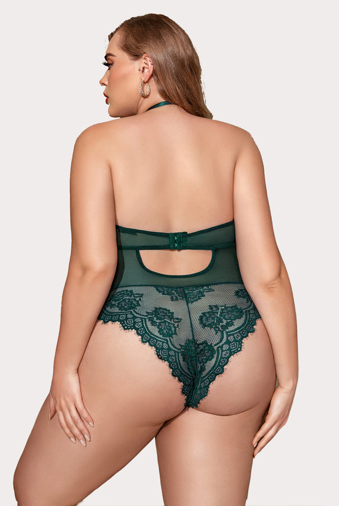 Emerald green plus size lace bodysuit featuring halter neck, cut-out back and floral lace pattern.