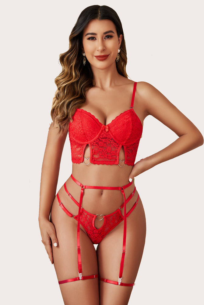 Red lace push-up lingerie set with heart details; garter belt and thong. Confident, sexy look.