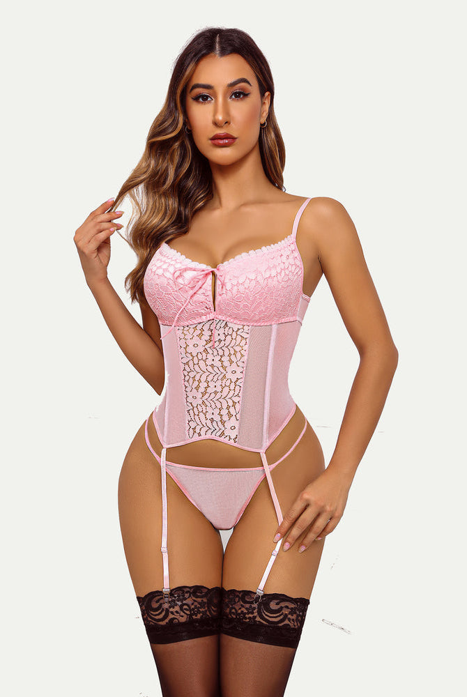 Pink lace wedding lingerie set with garter belt and stockings. Bridal boudoir outfit.